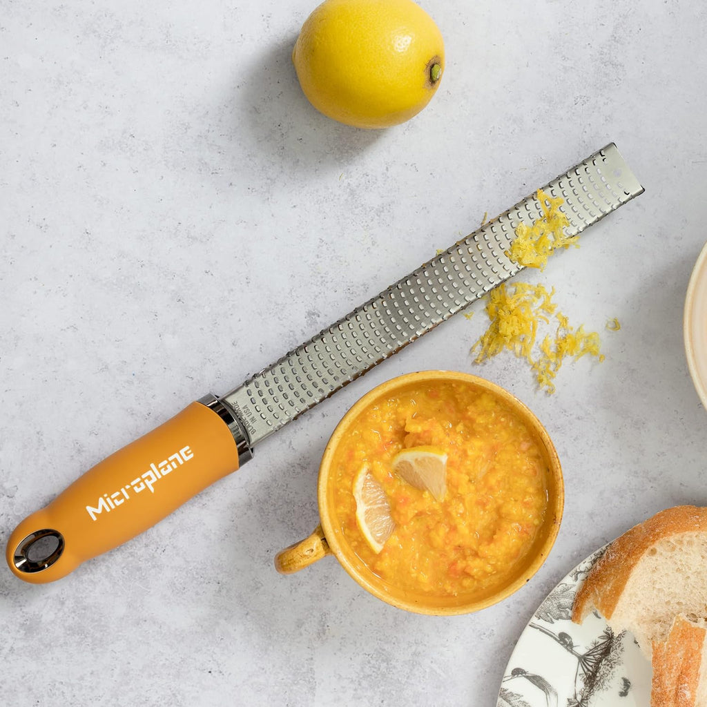 Microplane Premium Zester Grater in Mustard | Lemon Zester tool, Hard Cheese & Vegetable Grater | For Citrus, Parmesan Cheese, Garlic, Ginger, Nutmeg | Fine Stainless Steel Blade, Made in USA